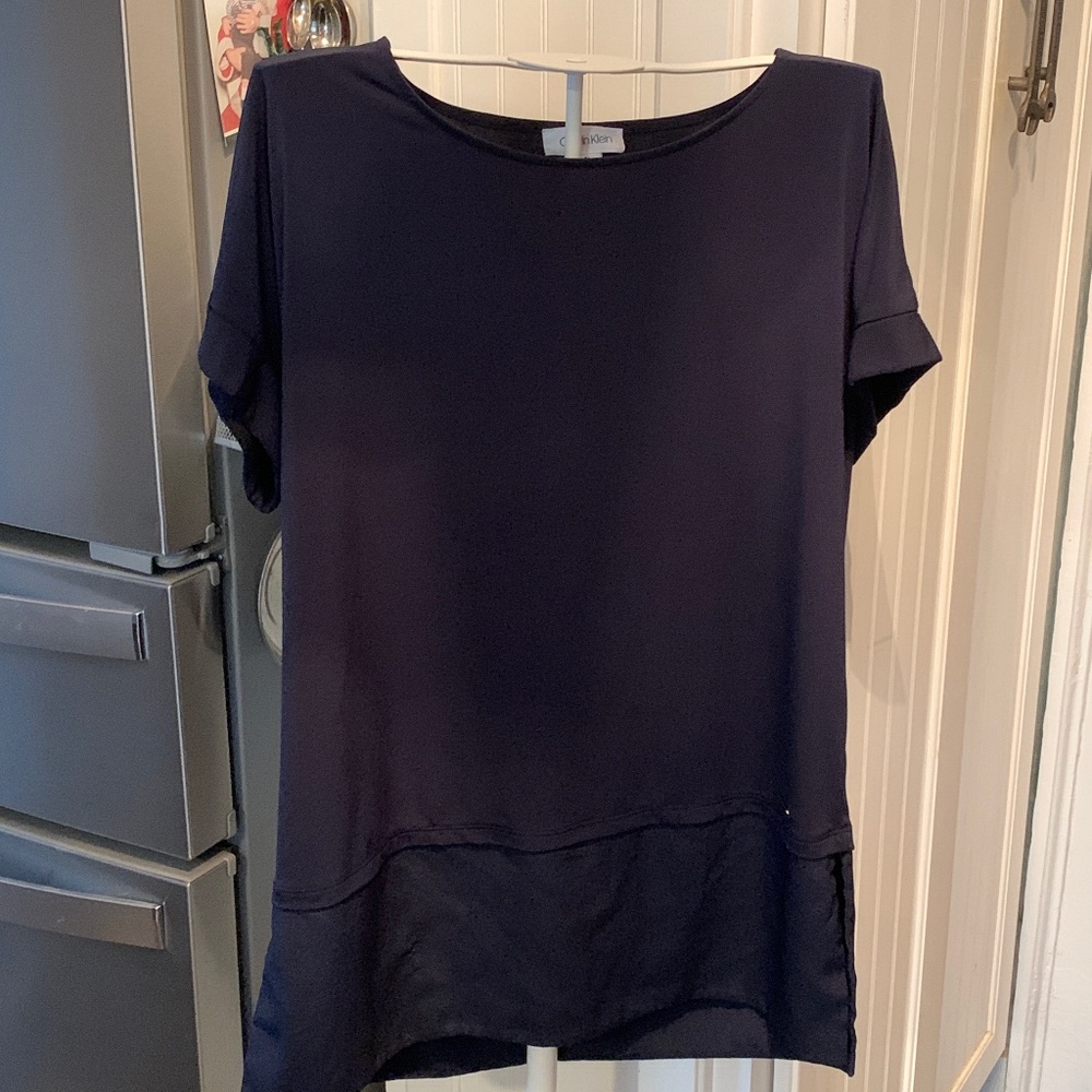 Calvin Klein never worn women’s metal logo blouse. Retail 79